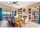 Living room with a fireplace, comfortable seating, and mountain views at 26639 N 132Nd St, Scottsdale, AZ 85262