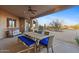 Covered patio with dining table and desert views at 26639 N 132Nd St, Scottsdale, AZ 85262