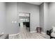 Hallway view into a living area with gray floors at 29202 N 170Th St, Rio Verde, AZ 85263