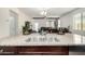 Kitchen island with granite countertop and double sink at 30966 W Fairmount Ave, Buckeye, AZ 85396