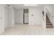 Kitchen area with refrigerator and staircase at 3205 S Laguna Dr, Chandler, AZ 85248