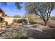 Relaxing backyard with fire pit, seating, and desert landscaping at 32051 N 73Rd Pl, Scottsdale, AZ 85266