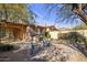 Backyard patio with fire pit, seating area, and built in BBQ at 32051 N 73Rd Pl, Scottsdale, AZ 85266