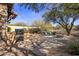 Outdoor kitchen and fire pit area in a desert landscape setting at 32051 N 73Rd Pl, Scottsdale, AZ 85266