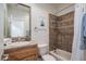 Clean bathroom with tile shower/tub combo and wood vanity at 32051 N 73Rd Pl, Scottsdale, AZ 85266