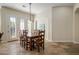 Dining area with wooden table and chairs, access to the patio at 32051 N 73Rd Pl, Scottsdale, AZ 85266