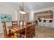 Bright dining area with wooden table and chairs, near kitchen at 32051 N 73Rd Pl, Scottsdale, AZ 85266