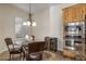 Kitchen nook with glass-top table, wine cooler, and built-in microwave at 32051 N 73Rd Pl, Scottsdale, AZ 85266