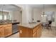 Kitchen island with granite countertop and seating for four at 32051 N 73Rd Pl, Scottsdale, AZ 85266