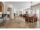 Open living area with fireplace, patio access and tiled floors at 32051 N 73Rd Pl, Scottsdale, AZ 85266