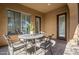 Covered patio with wrought iron table and chairs, ideal for outdoor dining at 32051 N 73Rd Pl, Scottsdale, AZ 85266