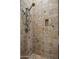 Clean shower with tile surround and shower caddy at 32051 N 73Rd Pl, Scottsdale, AZ 85266