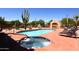 Community pool and spa with comfortable loungers at 38065 N Cave Creek Rd # 40, Cave Creek, AZ 85331