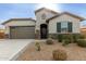 Single-story home with attached garage and landscaped front yard at 471 E Diamond Dr, Casa Grande, AZ 85122