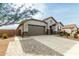 House exterior with a driveway and attached garage at 471 E Diamond Dr, Casa Grande, AZ 85122