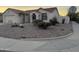 One-story house with desert landscaping and a two-car garage at 5153 W Wescott Dr, Glendale, AZ 85308