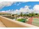 Aerial view shows a home with a large backyard, pool, and tennis court at 8611 E Cholla St, Scottsdale, AZ 85260