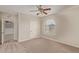 Bedroom with ceiling fan and arched window at 8611 E Cholla St, Scottsdale, AZ 85260