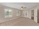 Spacious bedroom with French doors and ceiling fan at 8611 E Cholla St, Scottsdale, AZ 85260