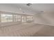 Spacious common area with carpet flooring and large windows at 8611 E Cholla St, Scottsdale, AZ 85260