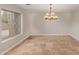 Bright dining room features tile flooring and a large window at 8611 E Cholla St, Scottsdale, AZ 85260