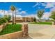 Front view of a luxurious home with a large driveway and a beautiful lawn at 8611 E Cholla St, Scottsdale, AZ 85260