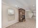 Gathering room with stone fireplace and carpet at 8611 E Cholla St, Scottsdale, AZ 85260