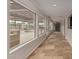Hallway with large windows overlooking the pool area at 8611 E Cholla St, Scottsdale, AZ 85260