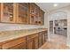 Kitchen boasts granite countertops and rich wood cabinetry at 8611 E Cholla St, Scottsdale, AZ 85260
