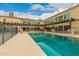 Large swimming pool with stone accents and pergola at 8611 E Cholla St, Scottsdale, AZ 85260