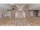Elegant curved staircase with stone wall detail at 8611 E Cholla St, Scottsdale, AZ 85260