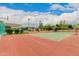 Tennis court with green surface and chain link fence at 8611 E Cholla St, Scottsdale, AZ 85260