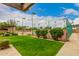 Private tennis court with green surface and fence at 8611 E Cholla St, Scottsdale, AZ 85260