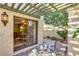 Private patio with pergola, table, and chairs, offering access to the interior at 8821 S 48Th St # 1, Phoenix, AZ 85044