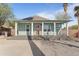 Renovated craftsman home with a front porch and a brick driveway at 930 E Taylor St, Phoenix, AZ 85006