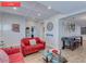 Living room with red couch, coffee table, and dining area at 930 E Taylor St, Phoenix, AZ 85006