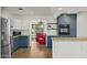 Modern kitchen with blue cabinetry, stainless steel appliances, and granite countertops at 1108 E Georgia Ave, Phoenix, AZ 85014