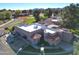 Aerial view of a charming home with Spanish-style architecture, located in a lush green golf course community at 11845 N 40Th Pl, Phoenix, AZ 85028