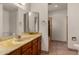 Bathroom with large vanity, tiled floor and shower stall at 1626 E Garnet Ave, Mesa, AZ 85204