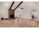 Bright living room with stone fireplace and access to kitchen at 1626 E Garnet Ave, Mesa, AZ 85204