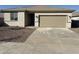 Single-story home with a two-car garage and neutral-colored exterior at 16798 W Maya Way, Surprise, AZ 85387