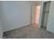 Simple bedroom with carpet flooring and a closet at 18128 N Bell Pointe Blvd, Surprise, AZ 85374