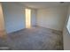 Spacious carpeted bedroom with access to bathroom at 18128 N Bell Pointe Blvd, Surprise, AZ 85374