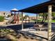 Playground with shaded seating and play equipment at 18128 N Bell Pointe Blvd, Surprise, AZ 85374