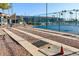 Community bocce ball court with benches and shade structure at 1891 E Kerby Farms Rd, Chandler, AZ 85249