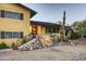 Charming yellow two-story home with a stone entryway at 2034 E Glendale Ave, Phoenix, AZ 85020