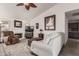 Cozy living room with fireplace and seating area at 20341 N 109Th Ave, Sun City, AZ 85373