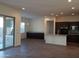 Open kitchen features island and stainless steel appliances at 21024 E Poco Calle St, Queen Creek, AZ 85142