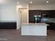 Kitchen island with granite countertop and dark cabinets at 21024 E Poco Calle St, Queen Creek, AZ 85142