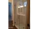 Frameless glass shower with modern fixtures at 21024 E Poco Calle St, Queen Creek, AZ 85142